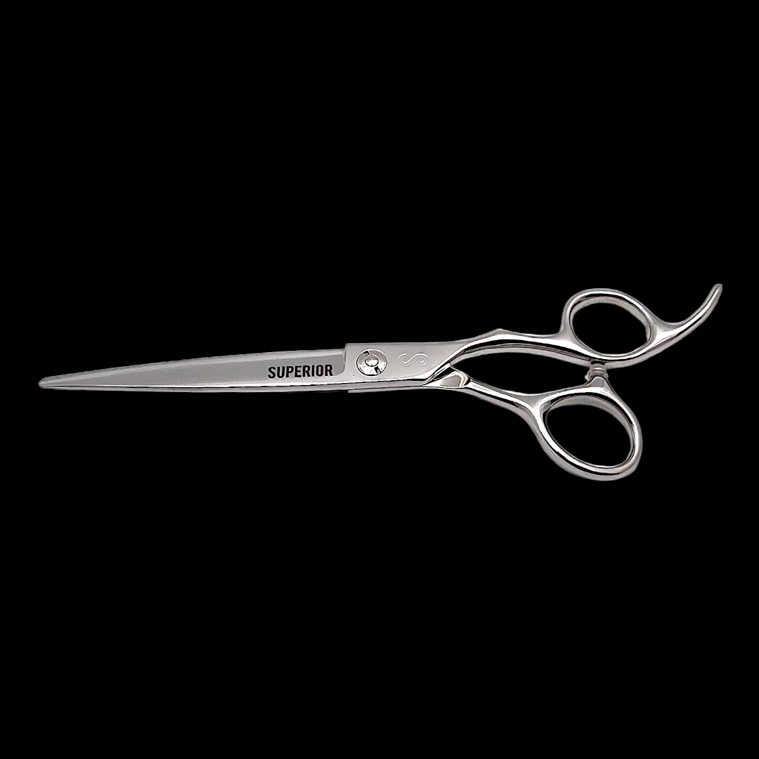 Silver scissors with 'Superior' branding on a black background